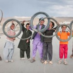 BAMYAN PROVINCE, Afghanistan - Local boys display the bicycle tires they race with on a street near Forward Operating Base Bamyan June 24, 2012. (U.S. Army photo by Sgt. Ken Scar, 7th Mobile Public Affairs Detachment) - published in Bamyan Province emerges as a model for Afghanistan’s potential by rceast