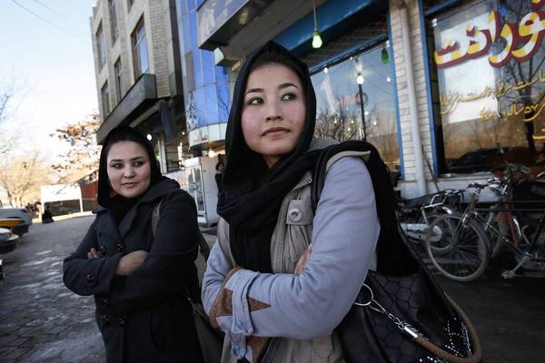 In Kabul, 2nd Lt. Sourya Saleh, 20, left, and 2nd Lt. Masooma Hussaini are Hazara air force helicopter pilots who were trained in the United States. (Carolyn Cole / Los Angeles Times / December 28, 2012)
